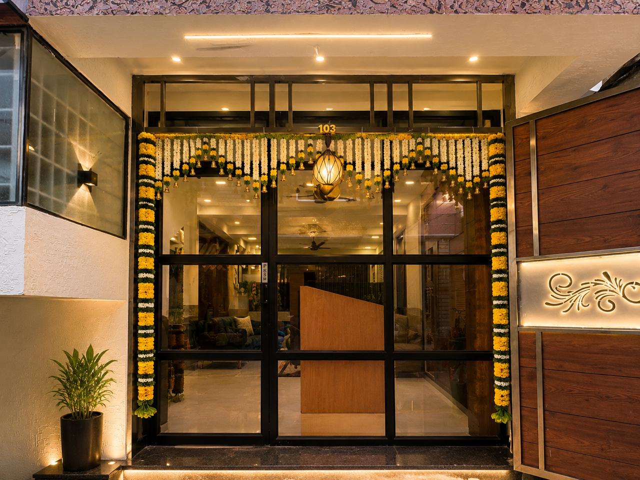 Illuminated entrance of AR Royal Co-Living